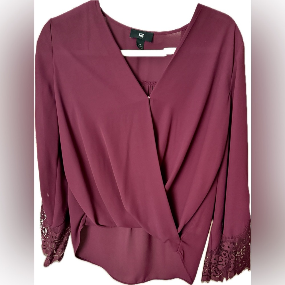 IZ Byer Wrap Blouse with Flowing Lace Sleeves and Shirtail Hem